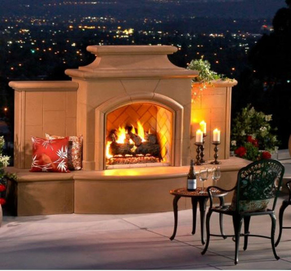 American Fyre Designs Grand Mariposa 113-inch outdoor natural gas fireplace on an outdoor patio at night