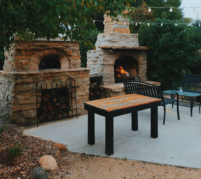 Fireplace in backyard outdoor space