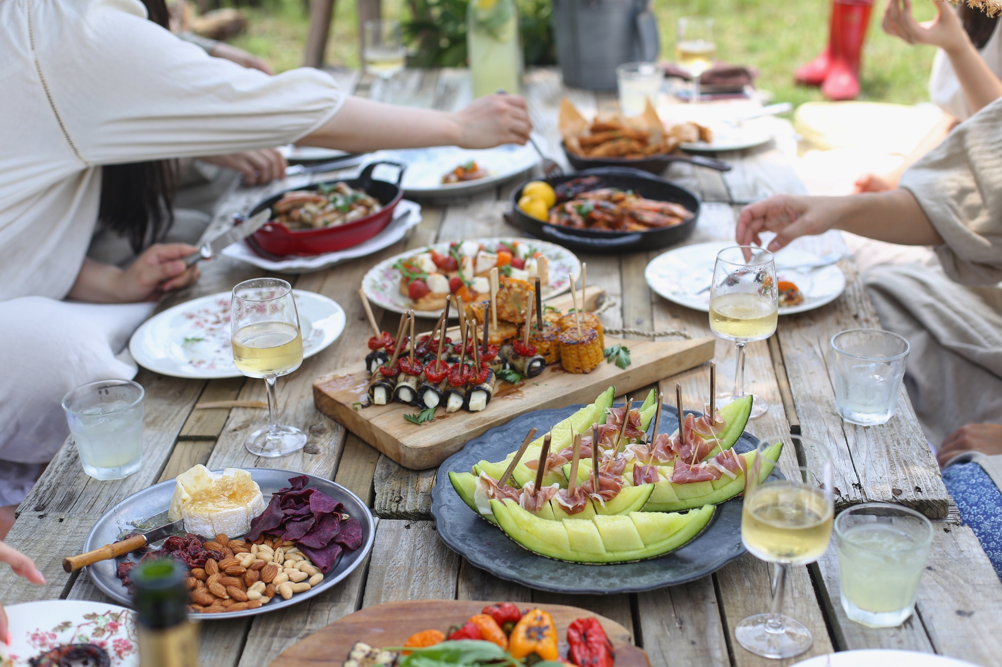 Picnic table filled with food