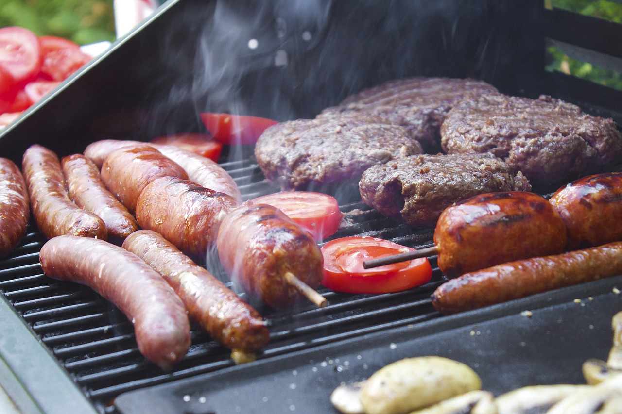 sausages and burgers on a grill