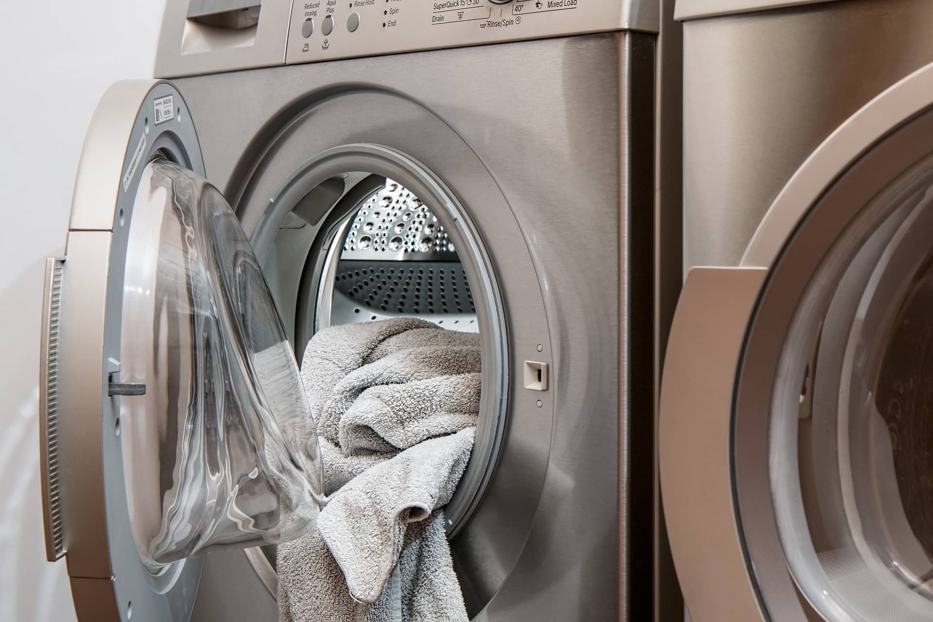 washer and dryer sitting beside each other